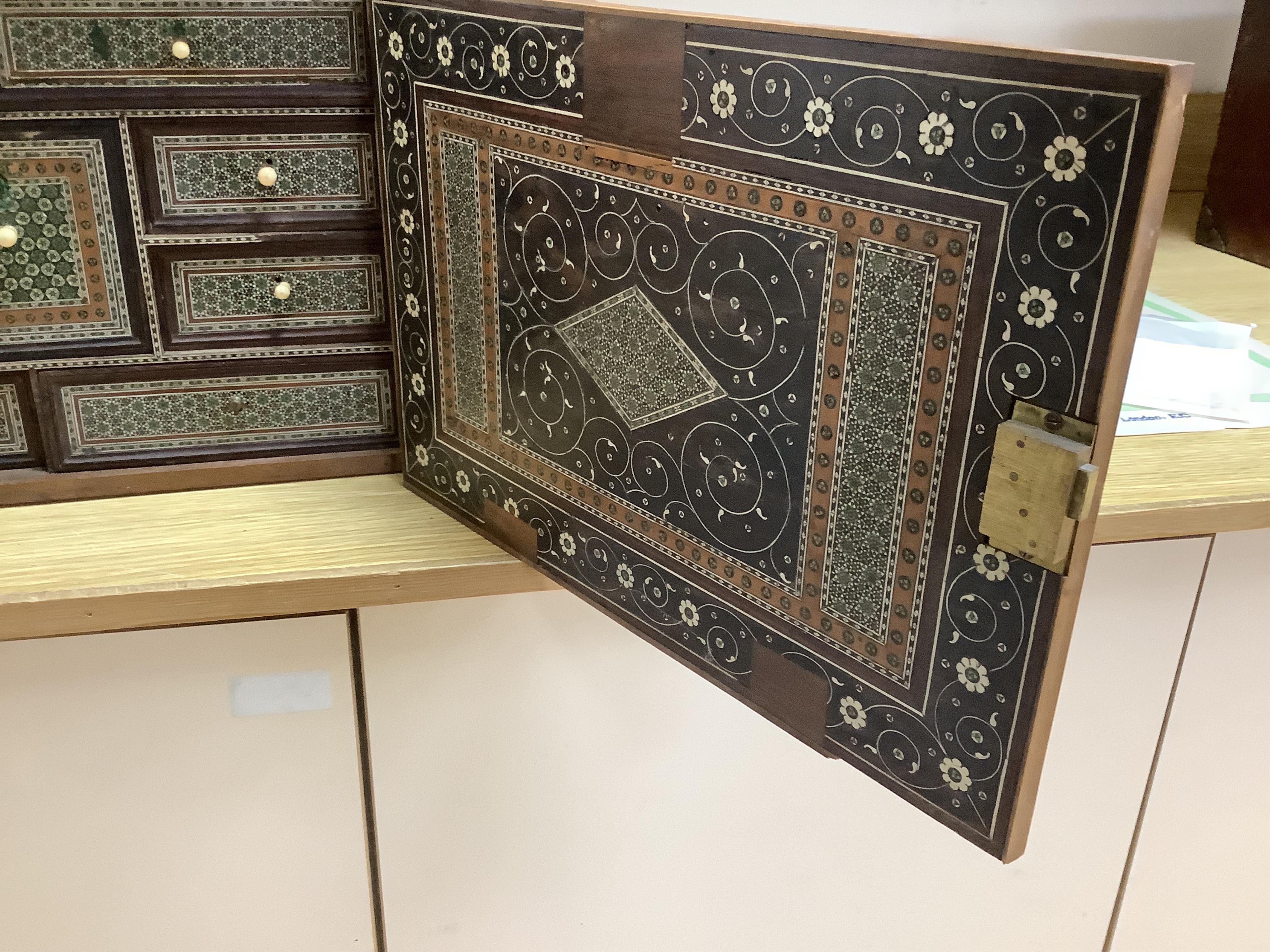 An early 17th century Indo-Portuguese ivory inlaid table cabinet, Gujarat, 29cm high. Condition - poor, losses CITES Submission reference 3XBFQXPT